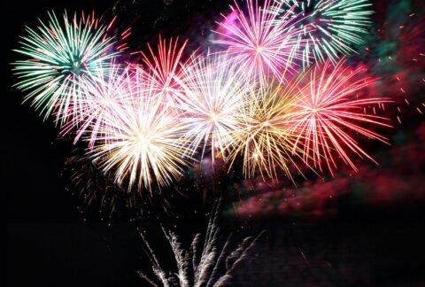 Spectacular fireworks display lighting up the night sky over Bournemouth Pier, England.